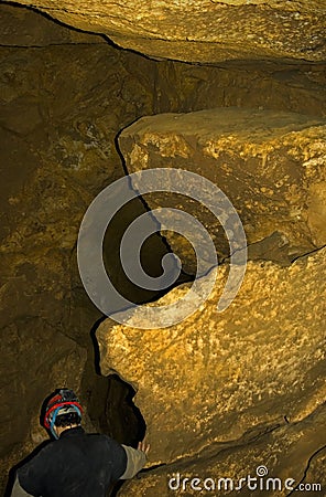 Man in cave Stock Photo