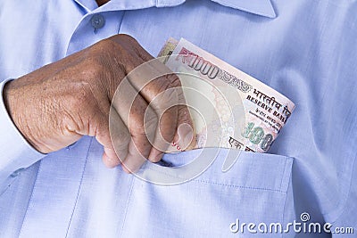 Man checking or counting Indian rupees in hand. Stock Photo