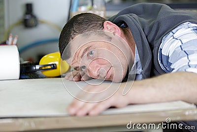 man checks evenness paint application Stock Photo