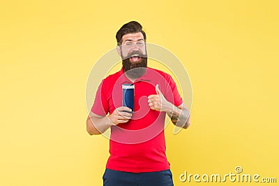 Man cheerful handsome bearded hipster hold bottle shampoo shower gel. Just fabulous hair. Shampoo conditioner for men Stock Photo