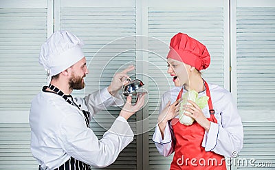 Man chef offer dessert or meal under cloche to girl. Will you eat my meal. Culinary family. Woman and bearded man Stock Photo