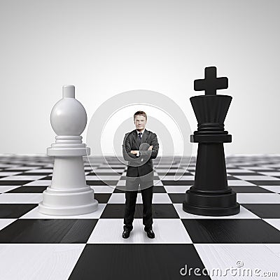 Man on chessboard Stock Photo