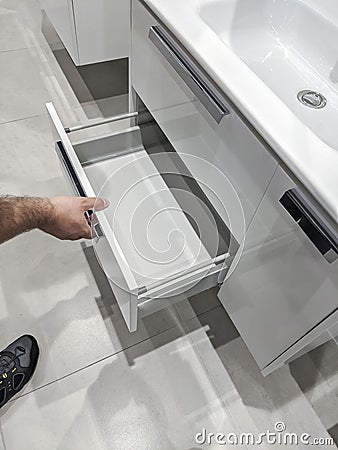 a man chooses a washbasin in a shopping mall Stock Photo