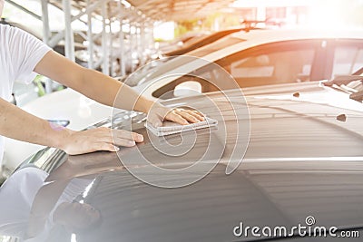 Man clean the car with cloth and polishing waxing cream,vintage picture style Stock Photo