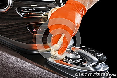 A man cleaning car with microfiber cloth. Car detailing or valeting concept. Selective focus. Car detailing. Cleaning with sponge. Stock Photo