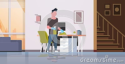 Man cleaning computer table with duster guy wiping workplace desk housework concept modern living room interior male Vector Illustration