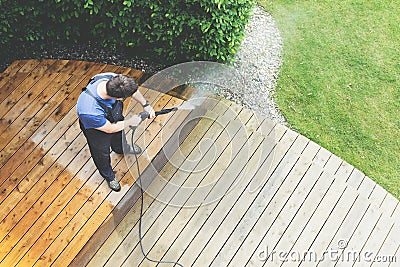 Cleaning terrace with a power washer - high water pressure clean Stock Photo