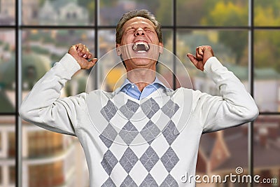 Man clenched his fists in excitement. Stock Photo