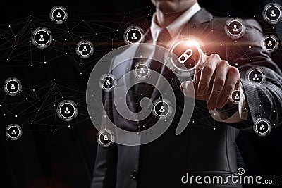 A man clicks the link icon in the network connecting users Stock Photo