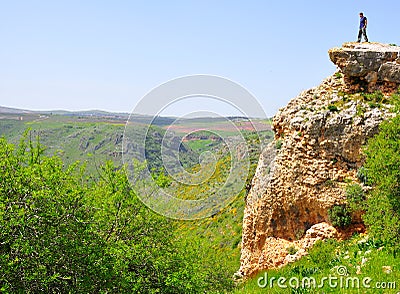 Man on cliff edge Stock Photo