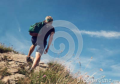 Man climb on mountain hill Stock Photo