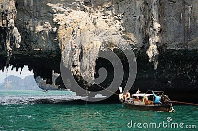 Man climb rock cliff Stock Photo