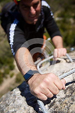 A man climbing a ferrata route in Calcena, Spanish mountains Stock Photo
