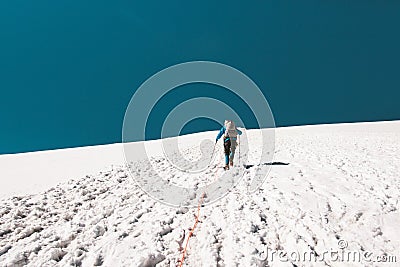 Man climbing in mountains glacier Stock Photo