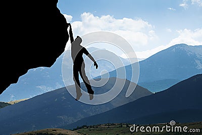 Man Climbing On Rocky Mountain Stock Photo