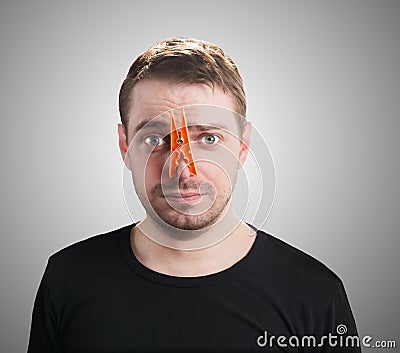 Man with clothespin on his nose. Stock Photo