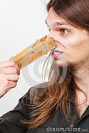 Man with clothespin on nose Stock Photo