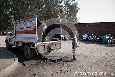 Man with coal loader Editorial Stock Photo