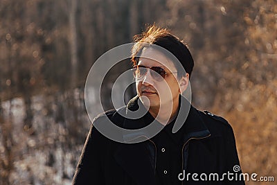 Man in coat and glasses Stock Photo