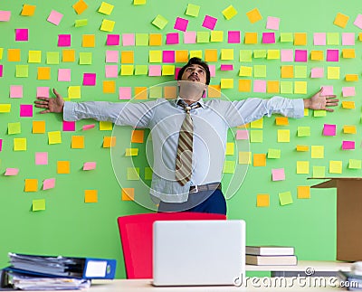 Man collecting his stuff after redundancy in the office with man Stock Photo