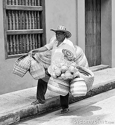 A man in Colombia carrying his baskets Editorial Stock Photo