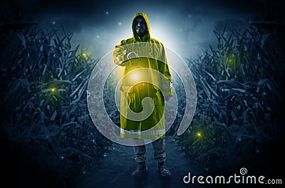 Man coming out from a thicket with lantern Stock Photo