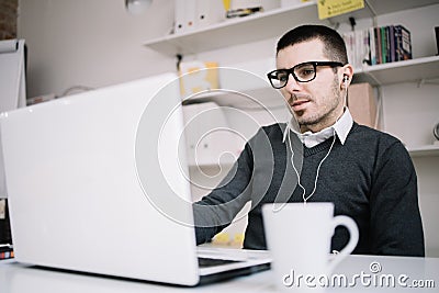 Man communicates with partners online using laptop Stock Photo