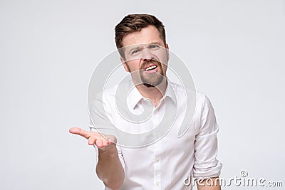 Man complaining or grumbling with hands forward trying to explain his point of view Stock Photo