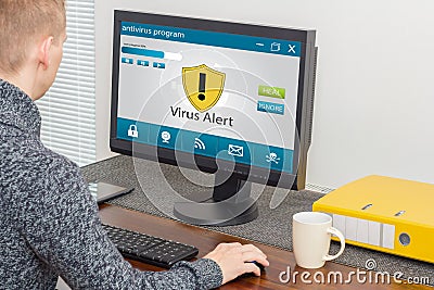 Man and computer antivirus Stock Photo