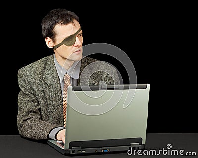 Man - computer pirate with laptop Stock Photo