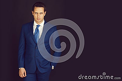 Man posing in stylish blue formal suit Stock Photo