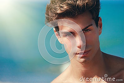 Man confident gaze, handsome face model. Hair style. Blue background Stock Photo