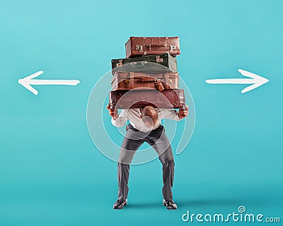 Man with a lot of luggages is confused about the right destination Stock Photo