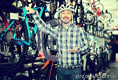 Man considering options for bike Stock Photo