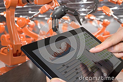 Man is controlling robotic arms with tablet. Automation and Industry 4.0 concept Stock Photo