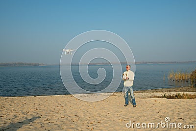 Man controls quadrocopter, drone Stock Photo