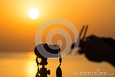 The man controls the quadrocopter using the remote control Stock Photo