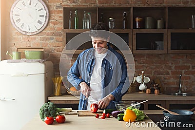 Man preparing delicious and healthy food in the home kitchen Stock Photo