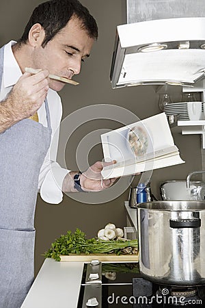 Man Cooking at Home Stock Photo