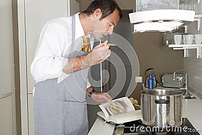 Man Cooking at Home Stock Photo