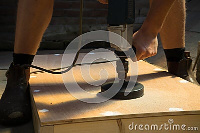 Man with Cornhole Board DIY Stock Photo