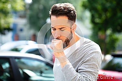 Man Coughing At Outdoor Stock Photo