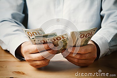 Man count money cash in his hand. Economy, saving, salary and donate concept. Stock Photo