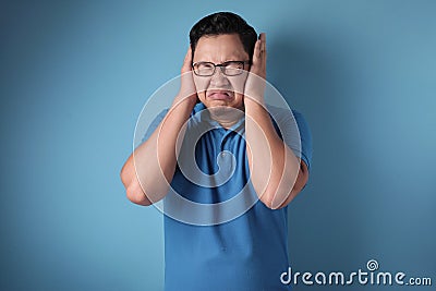 Man Covered his Ears Stock Photo
