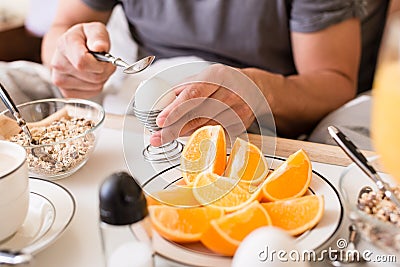 Man cracking open a boiled egg for breakfast Stock Photo