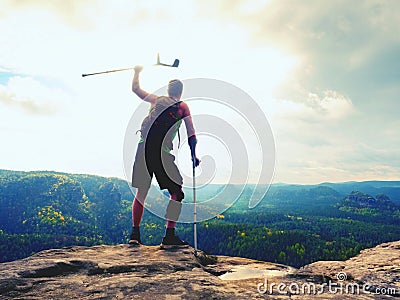 Man with a crutches and broken leg fixed in knee brace feature.Traveler with hurt leg in bandages Stock Photo