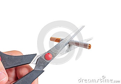 Man cuts a cigarette with scissors Stock Photo