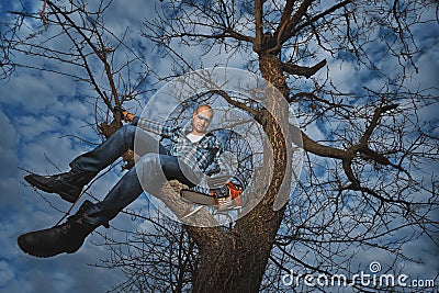 Man cutting a branch Stock Photo