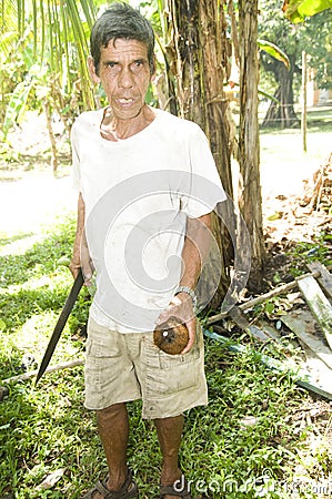 Man cutting coconut Nicaragua Stock Photo