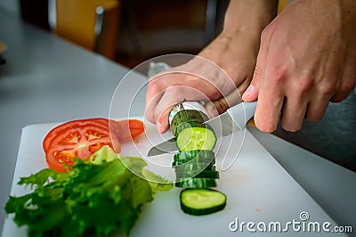 Man cutting vegetables Stock Photo